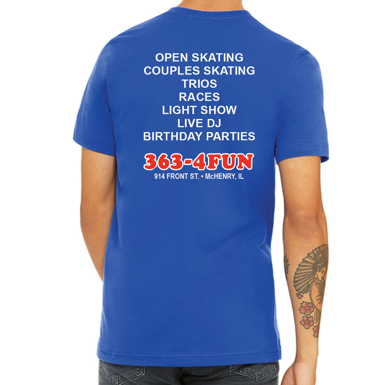 Blue t-shirt with white and red text on the back, displayed on a person.