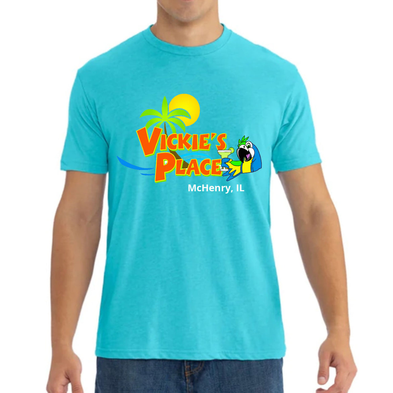 Person wearing a turquoise t-shirt with 'Vickie's Place' logo and text.