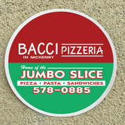 Round sign for Bacci Pizzeria with contact information on a textured surface