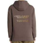 Brown hoodie with 'China Light Restaurant' text on the back