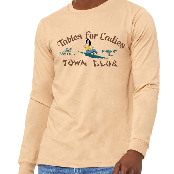 Beige long-sleeve shirt with graphic design and text on a white background