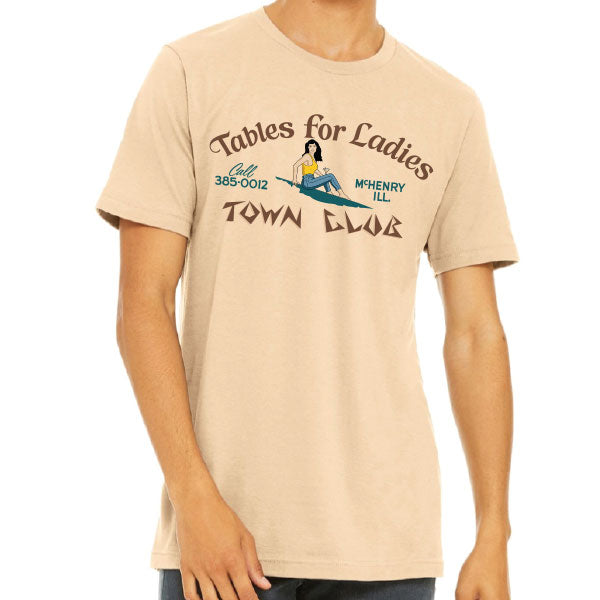 Beige t-shirt with graphic design and text on a white background